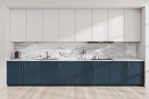 Modular kitchen cabinet interior with minimalist blue and white design and marble look backsplash and light wood floor