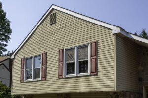 New windows on home with tan siding