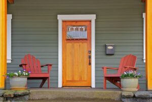 Light wood entry door to a green house