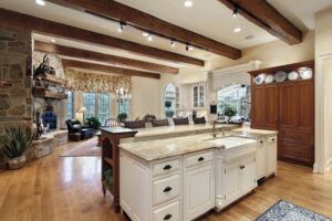 Large kitchen with a white island and granite countertop